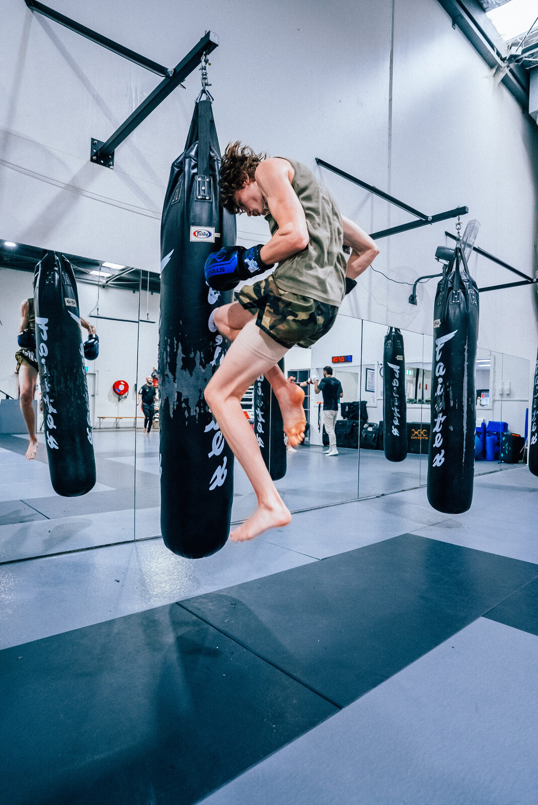 Flying knee on the heavy bag at the end of a round