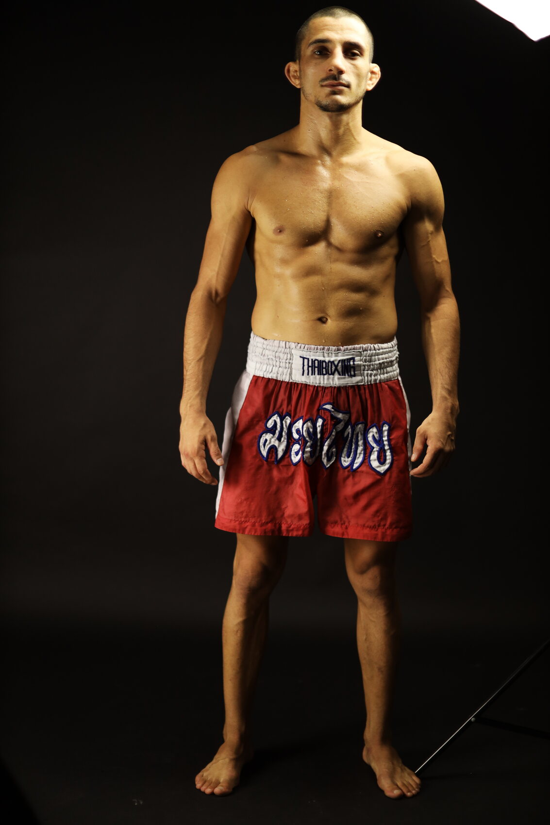 Studio portrait in Muay Thai shorts